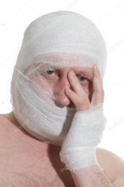 depositphotos_5100130-Man-with-bandage-on-head.-Looking-unhappy-at-something.
